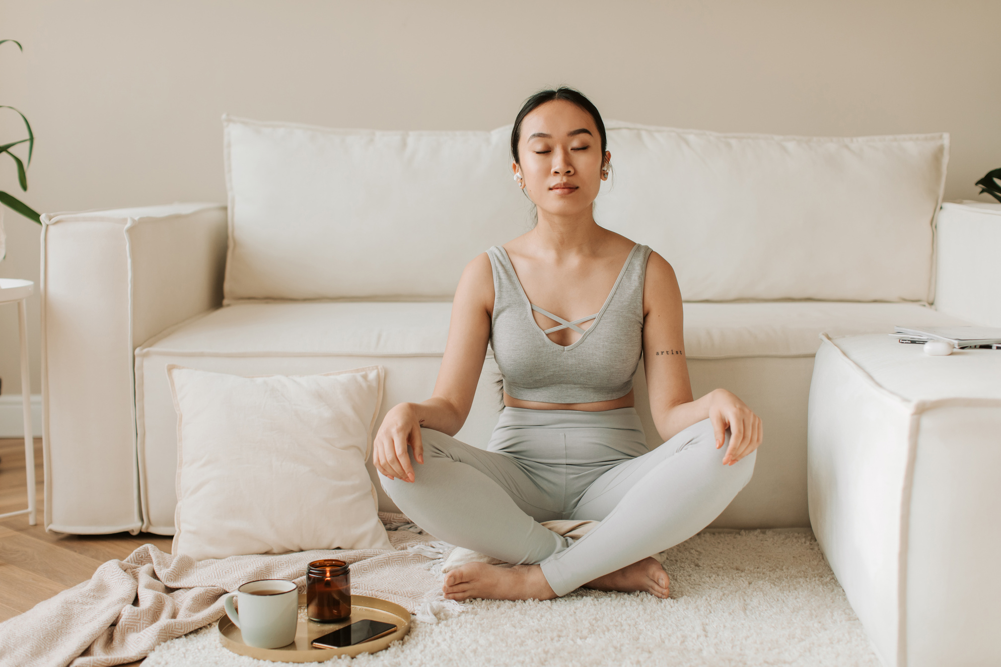 Woman Meditating at Home