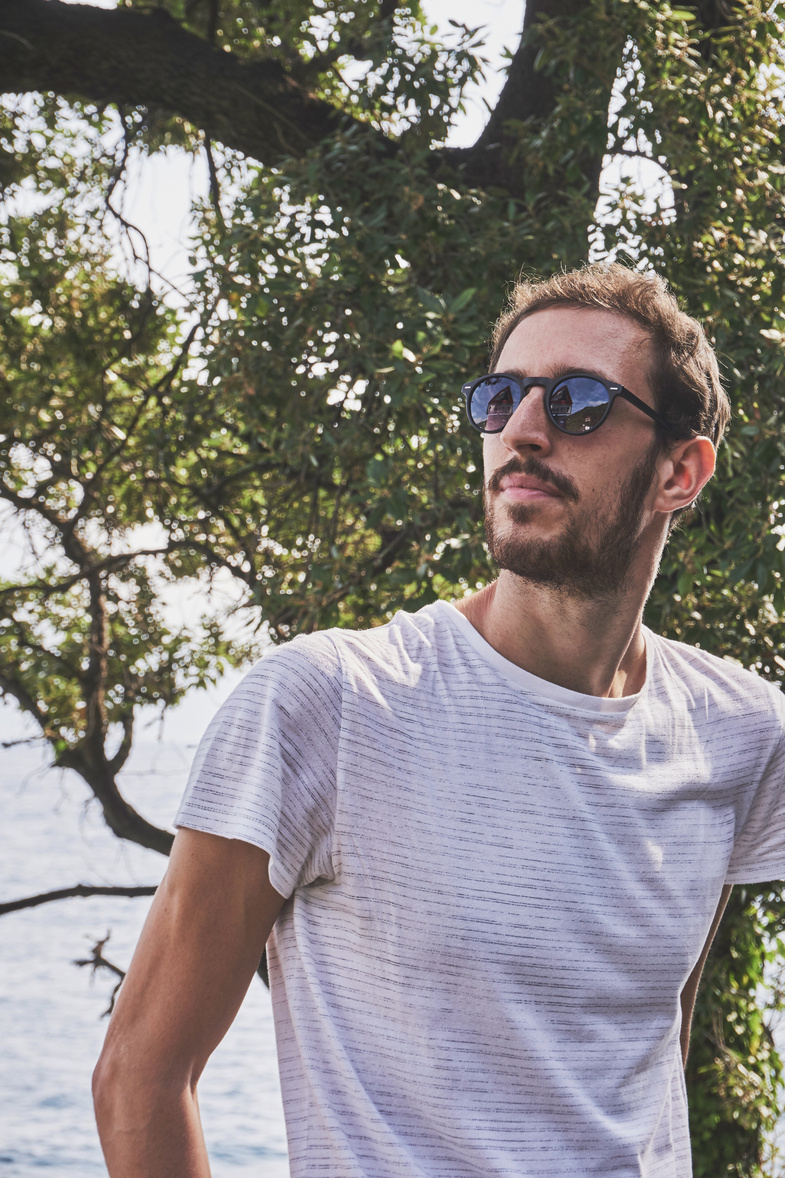 Man Wearing White Crew-neck T-shirt And Sunglasses 